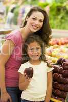 Mother and daughter shopping for fresh produce