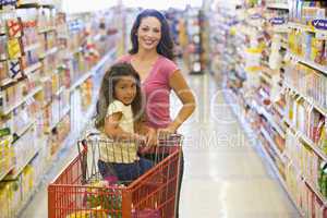 Mother and daughter grocery shopping