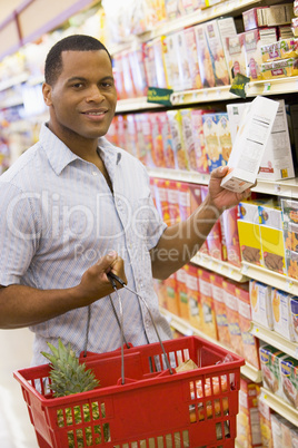 Young man grocery shopping