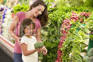 Mother and daughter shopping for fresh produce