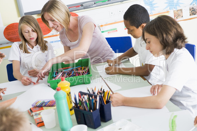 Schoolchildren and their teacher in an art class