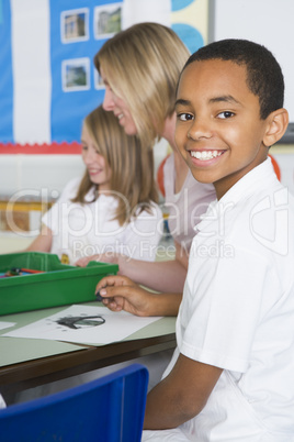 Schoolchildren and their teacher in an art class