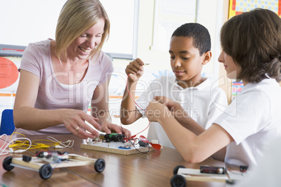 Schoolchildren and their teacher in a science class