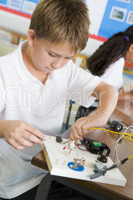 A schoolboy in a science class