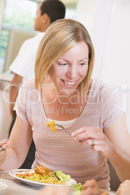 Teacher enjoying her lunch in a school cafeteria