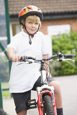 A young boy on a bicycle