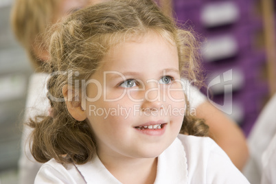 Schoolgirl sitting in primary class
