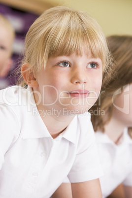 Schoolgirl sitting in primary class