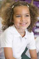 Schoolgirl sitting in primary class