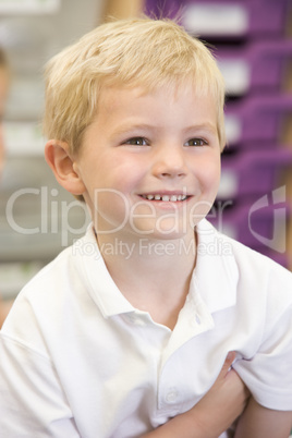 Schoolboy sitting in primary class