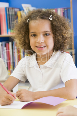 A schoolgirl sitting in a primary class
