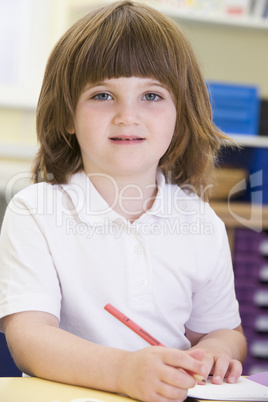 A schoolgirl sitting in a primary class
