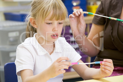 A schoolgirl in a primary class
