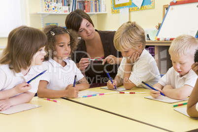 Schoolchildren and their teacher in a primary class