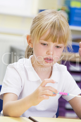 A schoolgirl in a primary class