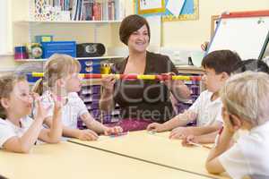 Schoolchildren and their teacher in a primary class