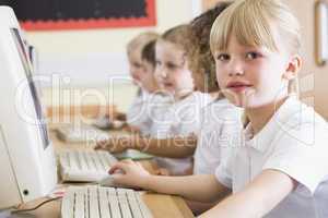 Girl working on a computer at primary school