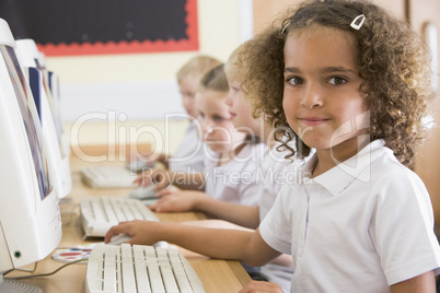 Girl working on a computer at primary school