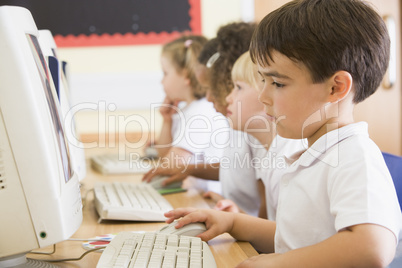 Boy working on a computer at primary school