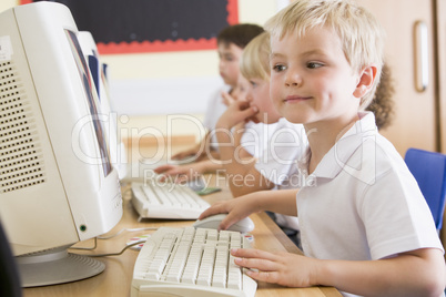 Boy working on a computer at primary school