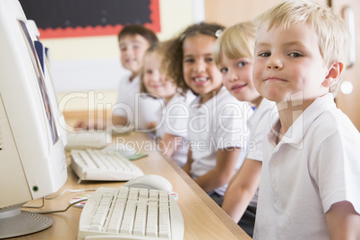 Boy working on a computer at primary school