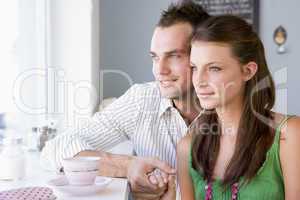 A young couple drinking tea in a cafe