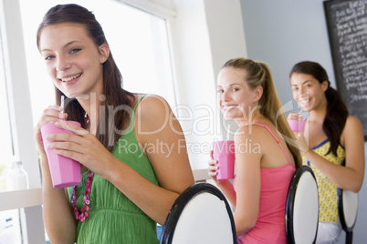 Young women drinking milkshakes in a cafe