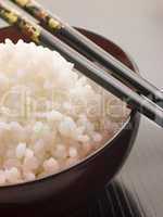 Bowl of Koshihikari Rice with chop sticks