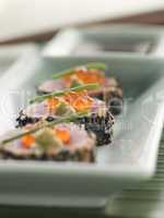 Seared Yellow Fin Tuna Rolled in Sesame seeds with Wasabi and Salmon Roe
