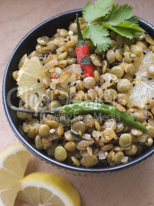 Bowl of Green Lentils cooked with Sliced Lemon Chili and Coriander