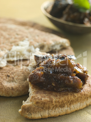 Pot of Brinjal Chutney with Naan Bread