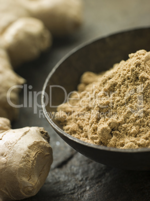 Dish of Ginger Powder with Fresh Ginger Root