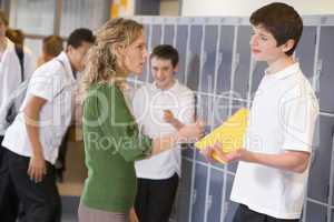 A teacher telling a student off