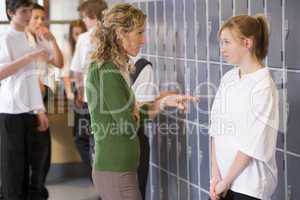 A teacher telling a student off