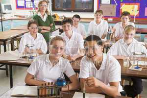 Schoolchildren and teacher in science class