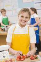 Schoolgirl at school in a cooking class