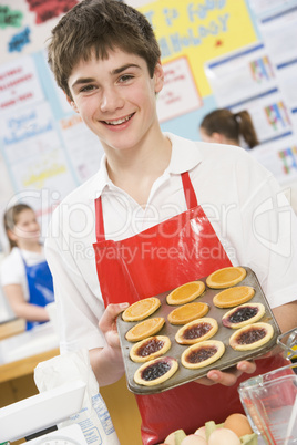 Schoolboy at school in a cooking class