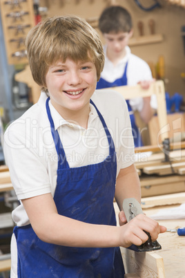 Schoolboy in woodwork class