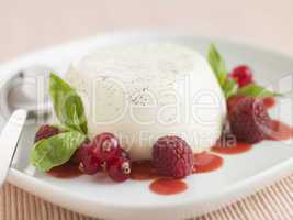 Vanilla Panna cotta with Raspberries Redcurrants and Coulis