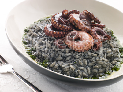 Risotto Nero with Fried Octopus and Pesto Dressing