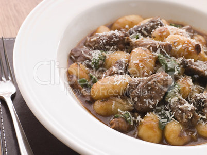 Oxtail Braised in Red Wine with Basil Gnocchi and Parmesan Chees