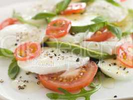 Tomato Avocado and Mozzarella Salad with Olive Oil and Black Pep