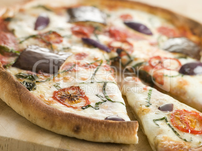 Tomato Mozzarella Aubergine and Basil Pizza