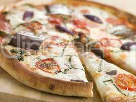 Tomato Mozzarella Aubergine and Basil Pizza