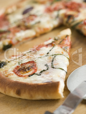 Slice of Tomato Mozzarella Aubergine and Basil Pizza