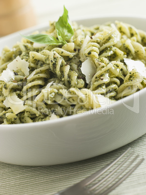 Bowl of Fusilli Pasta dressed in Pesto with Parmesan Shaves