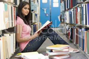 University student studying in library