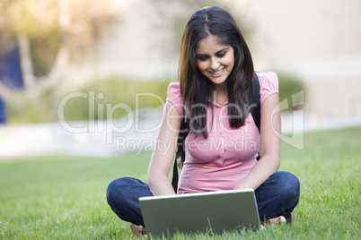 University student using laptop outside