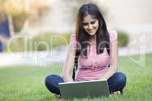 University student using laptop outside