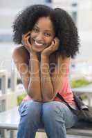 Female student sitting outside